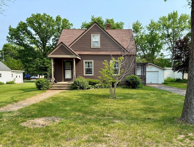 230 Burrwood Ave, Loves Park, IL 61111 - view of front of house with an outdoor structure, a chimney, a front yard, driveway, and a detached garage