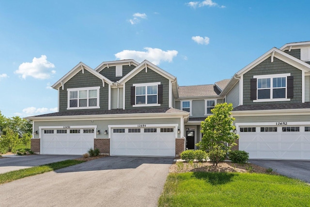 12654 S Talbot Cir, Plainfield, IL 60585 - view of front facade with brick siding, an attached garage, and driveway