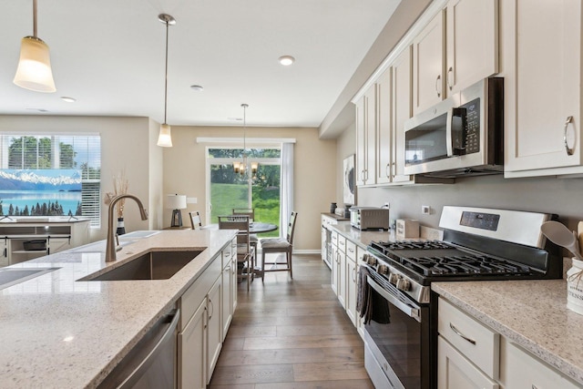 12654 S Talbot Cir, Plainfield, IL 60585 - kitchen with appliances with stainless steel finishes, a sink, plenty of natural light, wood-type flooring, and recessed lighting