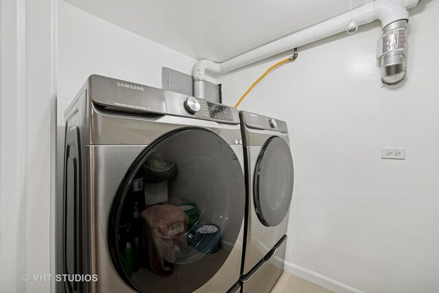 558 N Crystal St, Elgin, IL 60123 - laundry area featuring independent washer and dryer and tile patterned flooring