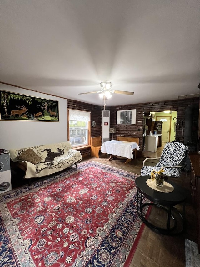 2110 N Mobile Ave, Chicago, IL 60639 - bedroom with wood finished floors, brick wall, and ceiling fan