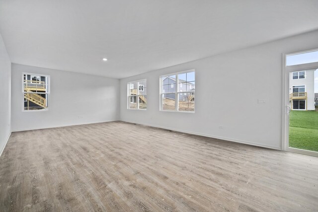 14807 S Greenbriar Dr, Plainfield, IL 60544 - unfurnished living room featuring wood finished floors