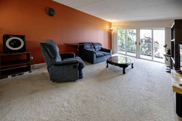 7021 W Touhy Ave Unit 305, Niles, IL 60714 - living area featuring carpet and vaulted ceiling