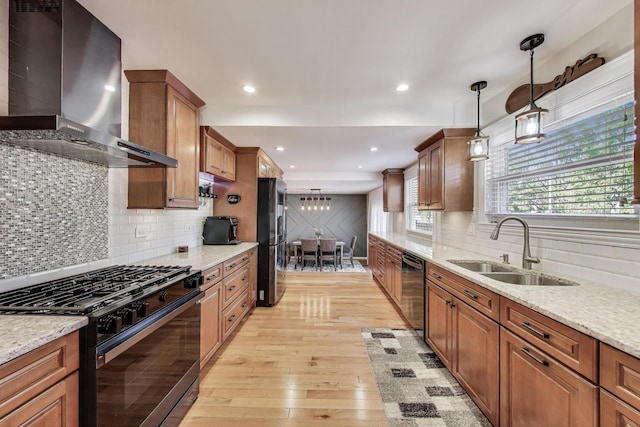 6 Plover Ct, Woodridge, IL 60517 - kitchen featuring black range with gas stovetop, wall chimney range hood, freestanding refrigerator, a sink, and dishwashing machine