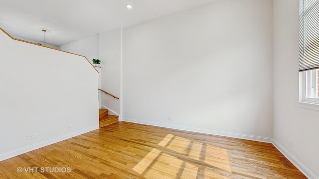 3649 W Cornelia Ave Unit C, Chicago, IL 60618 - spare room featuring light wood-style flooring and baseboards