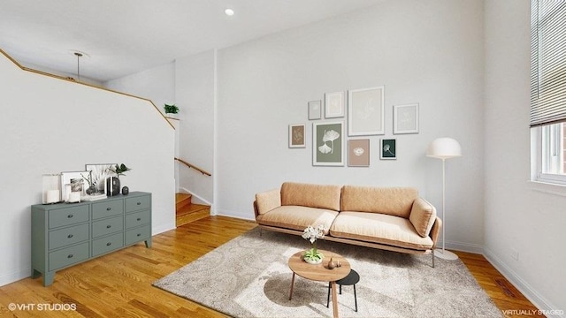 3649 W Cornelia Ave Unit C, Chicago, IL 60618 - living area with light wood-style floors, stairway, and baseboards