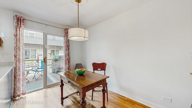 3649 W Cornelia Ave Unit C, Chicago, IL 60618 - dining area with light wood-style flooring and baseboards