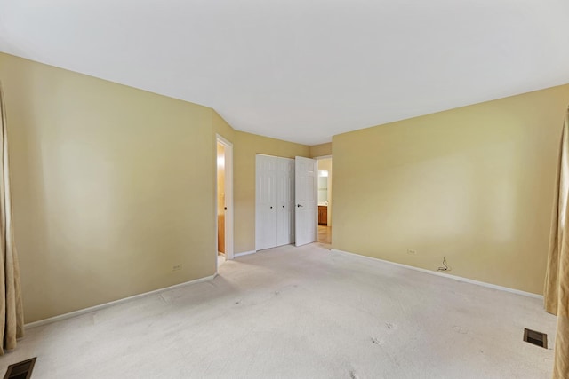 1604 Newburn Ct Unit D1, Wheeling, IL 60090 - unfurnished bedroom with light carpet, baseboards, and ensuite bathroom