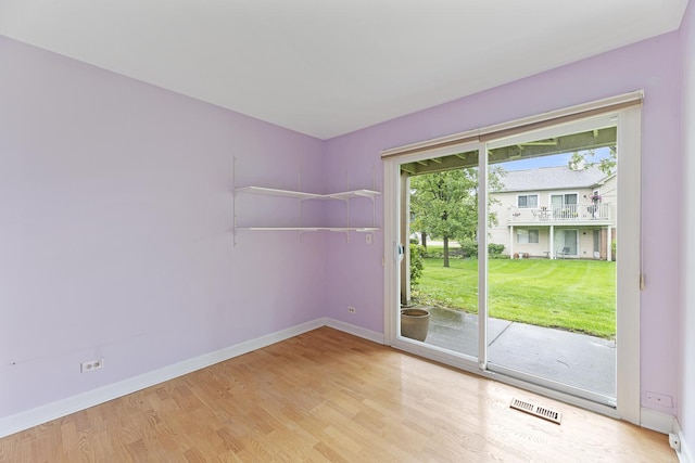 1604 Newburn Ct Unit D1, Wheeling, IL 60090 - empty room with baseboards and wood finished floors