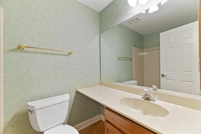 1604 Newburn Ct Unit D1, Wheeling, IL 60090 - bathroom with toilet, vanity, a shower, wood finished floors, and baseboards