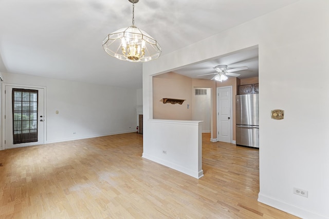 1604 Newburn Ct Unit D1, Wheeling, IL 60090 - empty room featuring a chandelier, light wood-style flooring, baseboards, and a ceiling fan