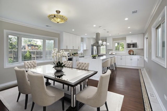 1012 Windsor Rd, Highland Park, IL 60035 - dining area featuring ornamental molding, baseboards, dark wood-style flooring, and recessed lighting