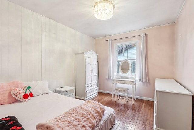 11537 S Neenah Ave, Worth, IL 60482 - bedroom featuring hardwood / wood-style flooring, a chandelier, and baseboards