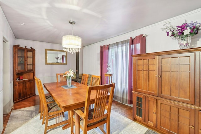 11537 S Neenah Ave, Worth, IL 60482 - dining area featuring a chandelier and light wood-style flooring