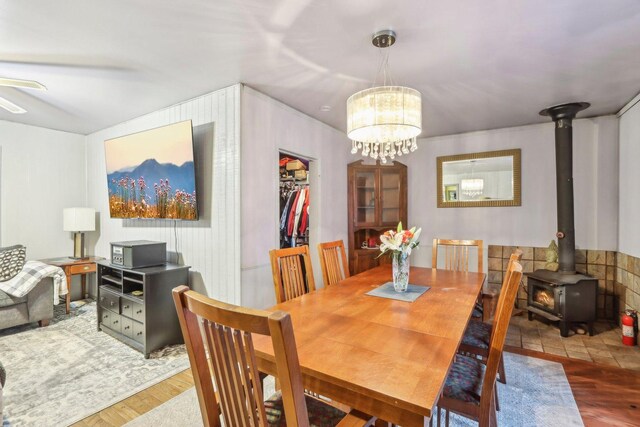 11537 S Neenah Ave, Worth, IL 60482 - dining space with a wood stove, wood finished floors, and ceiling fan