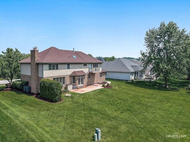 10521 Buck Dr, Orland Park, IL 60467 - rear view of house with a patio area, brick siding, a yard, and a chimney