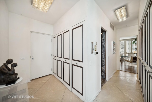 1300 N Lake Shore Dr Unit 18D, Chicago, IL 60610 - hallway with light tile patterned flooring