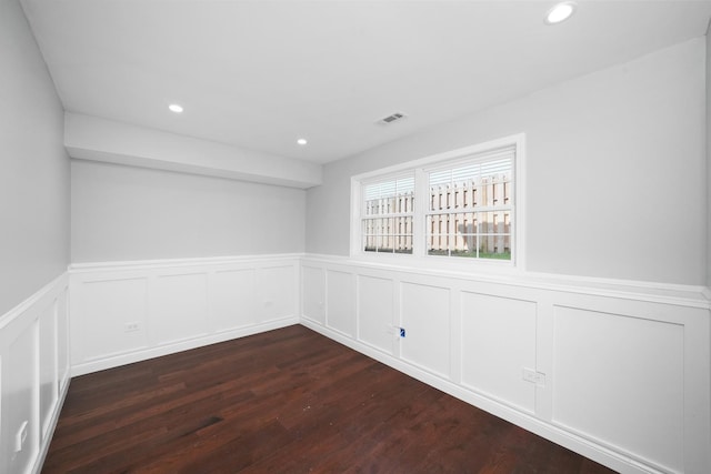 1012 Concord Dr, Bartlett, IL 60103 - empty room featuring a wainscoted wall, dark wood-style floors, a decorative wall, and recessed lighting