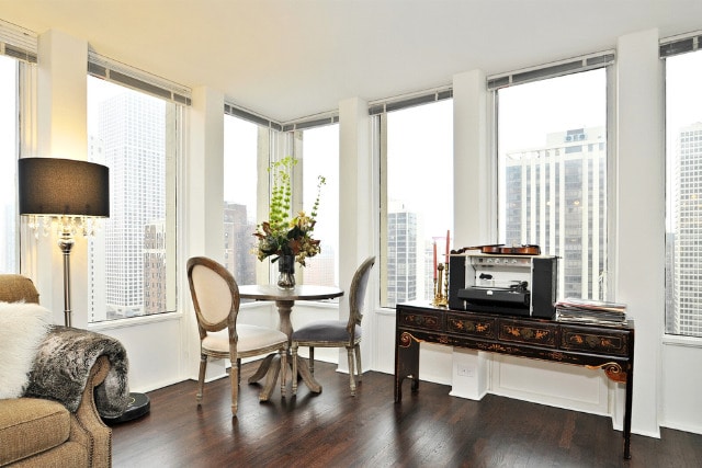 100 E Walton St Unit 22H, Chicago, IL 60611 - dining room featuring dark wood finished floors and expansive windows