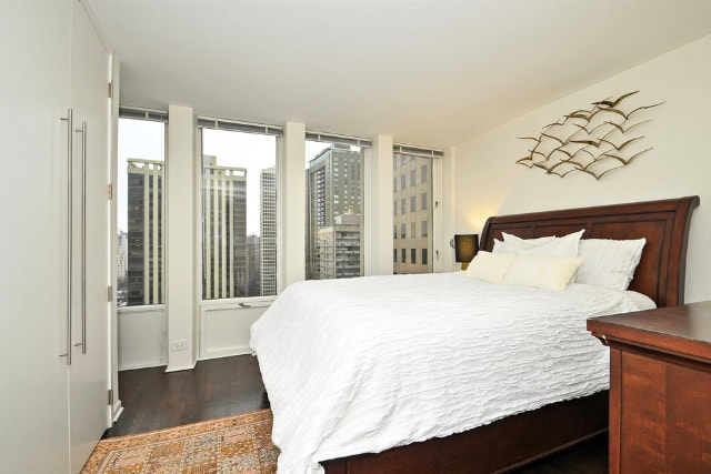 100 E Walton St Unit 22H, Chicago, IL 60611 - bedroom featuring dark wood-style flooring