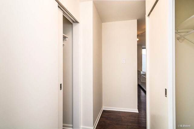 100 E Walton St Unit 22H, Chicago, IL 60611 - hallway featuring dark wood-type flooring and baseboards