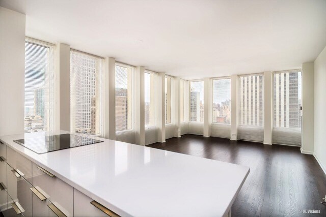 100 E Walton St Unit 22H, Chicago, IL 60611 - living room featuring wood finished floors