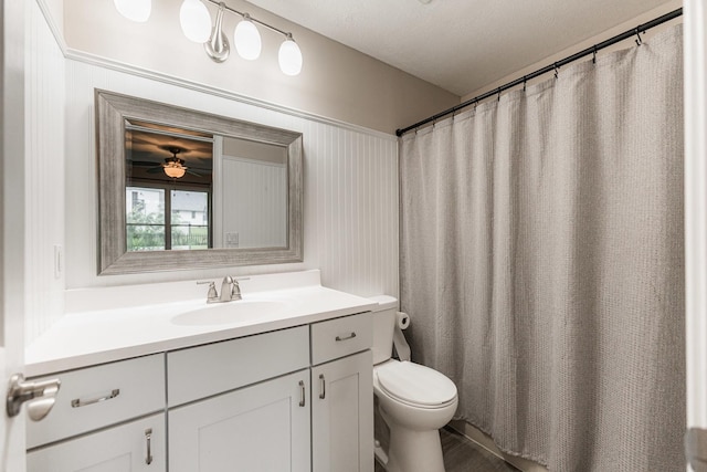 30 Beau Meade Rd, Oswego, IL 60543 - bathroom featuring vanity, toilet, a ceiling fan, and a shower with shower curtain