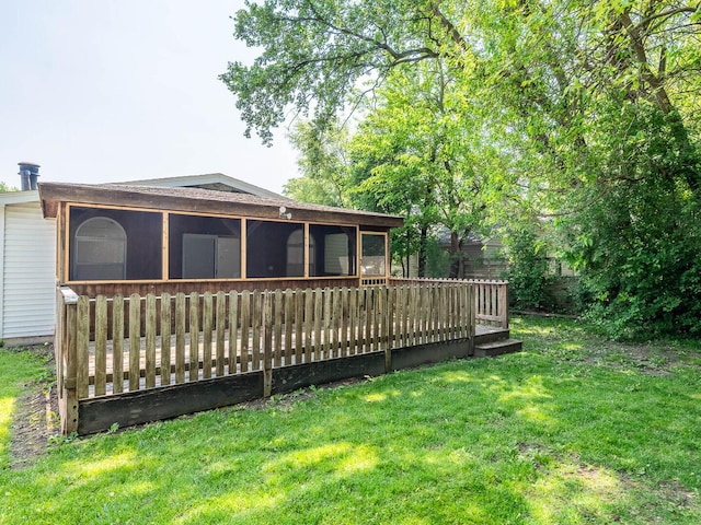 52 S Hawthorne Blvd, Mundelein, IL 60060 - rear view of house featuring a sunroom, a lawn, and a deck