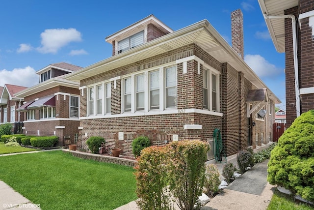 8212 S Bishop St, Chicago, IL 60620 - view of front of property with brick siding and a front lawn