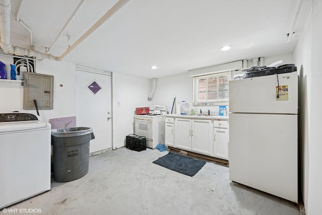 8212 S Bishop St, Chicago, IL 60620 - kitchen with white appliances, washer / dryer, concrete floors, white cabinets, and light countertops