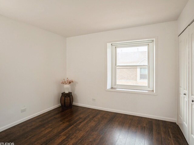 1812 Bristol Walk Unit 1812, Hoffman Estates, IL 60169 - unfurnished bedroom with baseboards, dark wood-style floors, and a closet