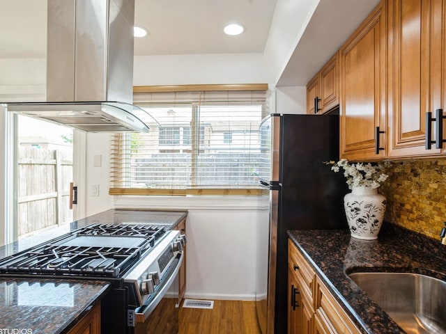 1812 Bristol Walk Unit 1812, Hoffman Estates, IL 60169 - kitchen with appliances with stainless steel finishes, island exhaust hood, a sink, brown cabinetry, and wood finished floors