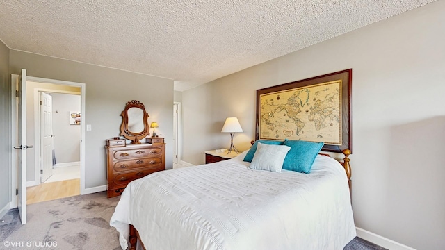5400 Walnut Ave Unit 201, Downers Grove, IL 60515 - bedroom featuring carpet floors and a textured ceiling