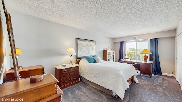 5400 Walnut Ave Unit 201, Downers Grove, IL 60515 - bedroom featuring dark colored carpet and a textured ceiling
