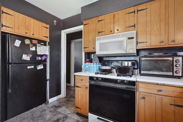 17715 Roy St, Lansing, IL 60438 - kitchen featuring freestanding refrigerator, white microwave, gas stove, and light countertops