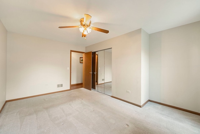3072 Carlton Ct, Westchester, IL 60154 - unfurnished bedroom with light colored carpet, a ceiling fan, and a closet