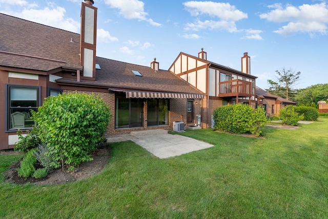 3072 Carlton Ct, Westchester, IL 60154 - back of house with a yard, brick siding, a patio, and a shingled roof