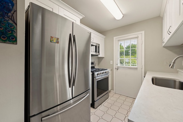 3072 Carlton Ct, Westchester, IL 60154 - kitchen with stainless steel appliances, light floors, light countertops, and white cabinetry