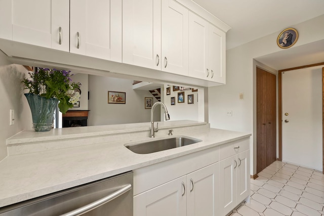 3072 Carlton Ct, Westchester, IL 60154 - kitchen with dishwasher, white cabinets, and light floors
