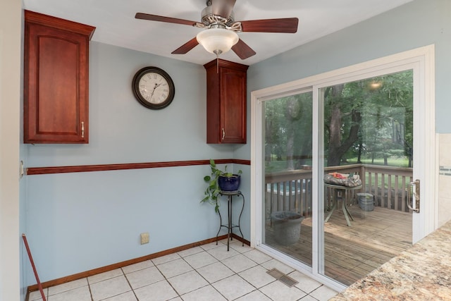8524 Carriage Hills Rd, Bloomington, IL 61705 - unfurnished dining area with ceiling fan and light tile patterned floors