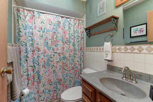 8524 Carriage Hills Rd, Bloomington, IL 61705 - bathroom with tile walls, vanity, a shower with shower curtain, and a wainscoted wall