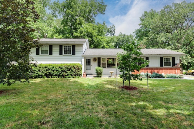 8524 Carriage Hills Rd, Bloomington, IL 61705 - split level home featuring a front lawn and brick siding
