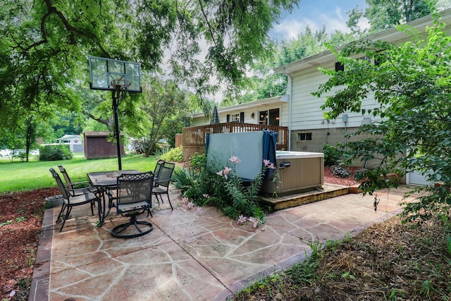 8524 Carriage Hills Rd, Bloomington, IL 61705 - view of patio with a hot tub, outdoor dining area, a storage shed, and a wooden deck