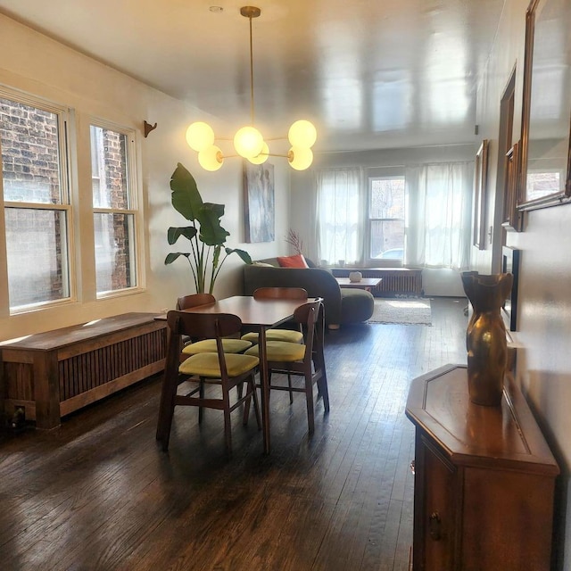 2040 W Shakespeare Ave, Chicago, IL 60647 - dining space with radiator heating unit and dark wood-style flooring