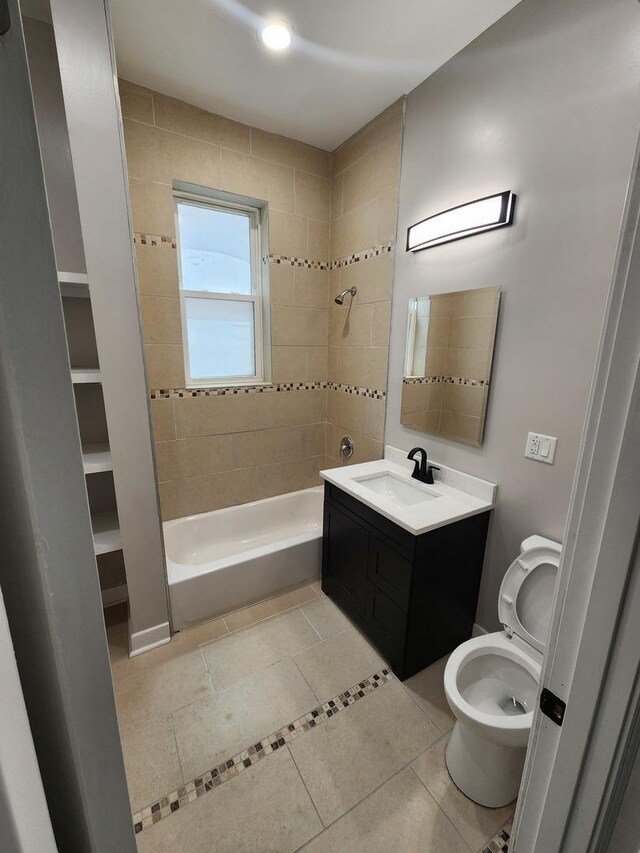 1332 S Lawndale Ave, Chicago, IL 60623 - bathroom featuring bathing tub / shower combination, vanity, and tile patterned flooring