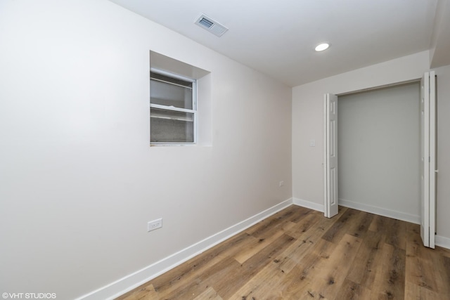 1332 S Lawndale Ave, Chicago, IL 60623 - unfurnished bedroom featuring wood finished floors, recessed lighting, and a closet