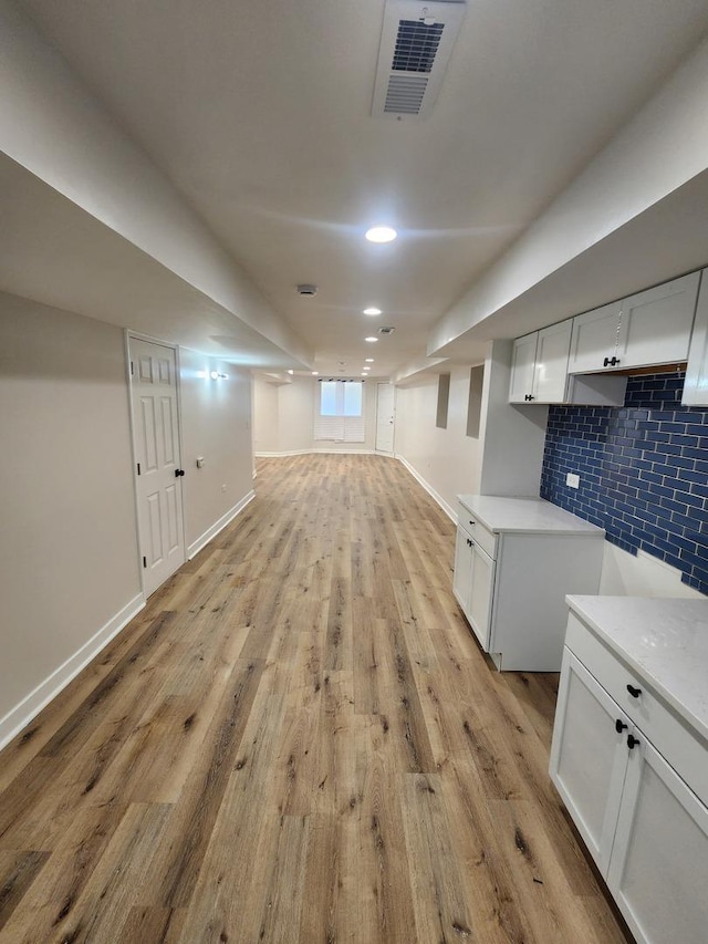 1332 S Lawndale Ave, Chicago, IL 60623 - finished below grade area with light wood-type flooring and recessed lighting