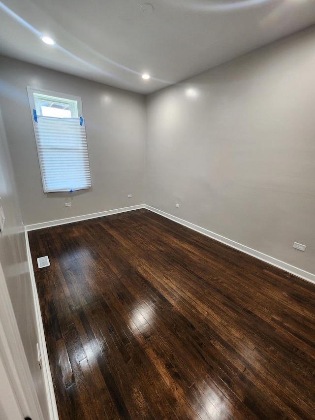 1332 S Lawndale Ave, Chicago, IL 60623 - empty room featuring dark wood-type flooring and recessed lighting