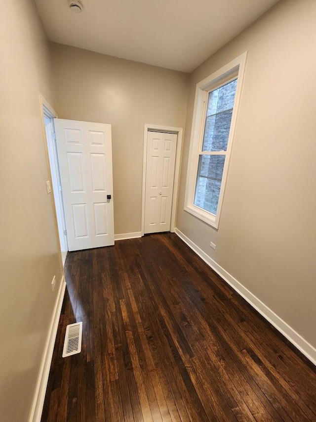 1332 S Lawndale Ave, Chicago, IL 60623 - unfurnished room featuring dark wood-style flooring and baseboards