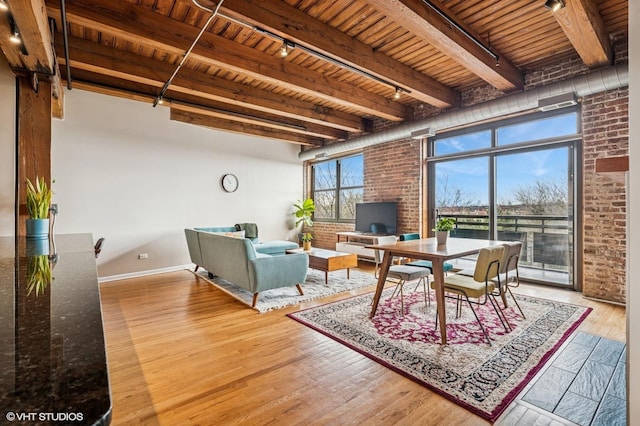 1735 W Diversey Pkwy Unit 402, Chicago, IL 60614 - dining room with wooden ceiling with exposed beams, wood finished floors, brick wall, baseboards, and an office area